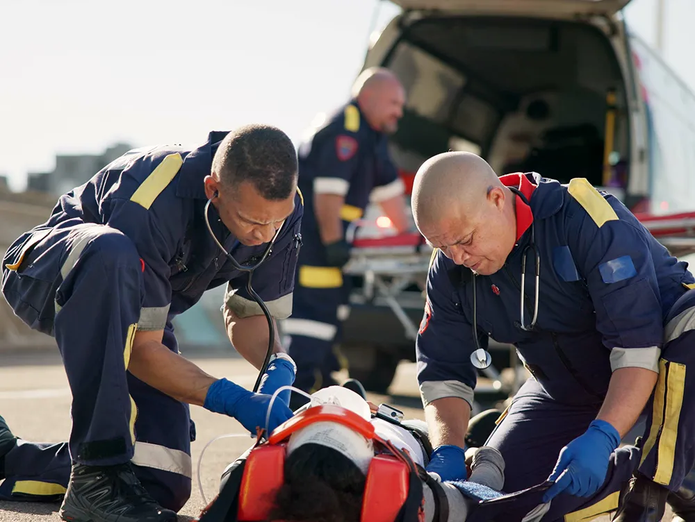Paramedics aiding injured person