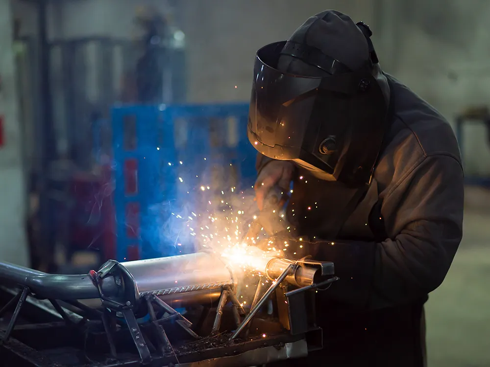 Welder working on metal